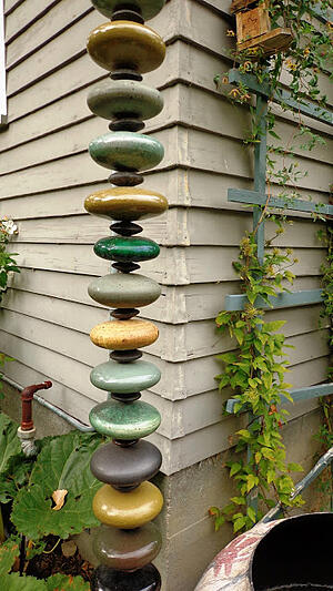 Sexy Rainwater Downspouts Add Jewel-Like Detail To Home Exterior