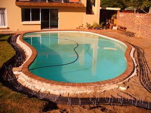 Adding Solar Heating to a Swimming Pool Using the Heat from Adjacent Pavers