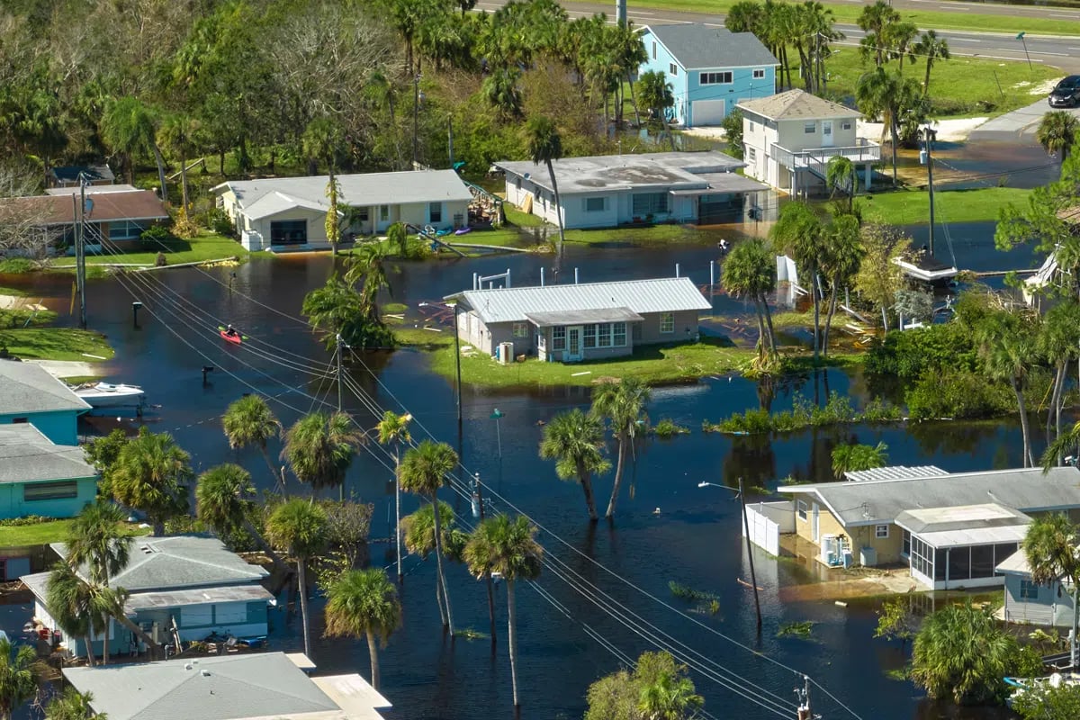 Hurricane Ian homes surrounded by water adobe stock