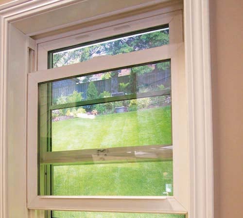 Interior storm-window panel fitted inside an existing window